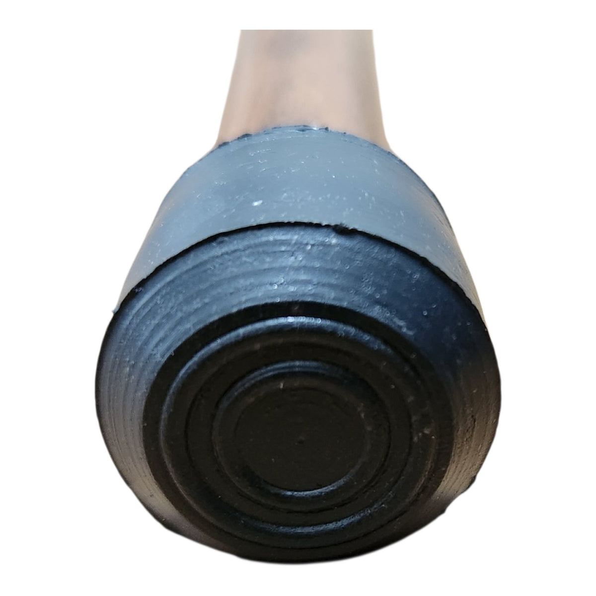 Close-up of the weighted rubber tip fitted to the base of every Walt Canes walking cane