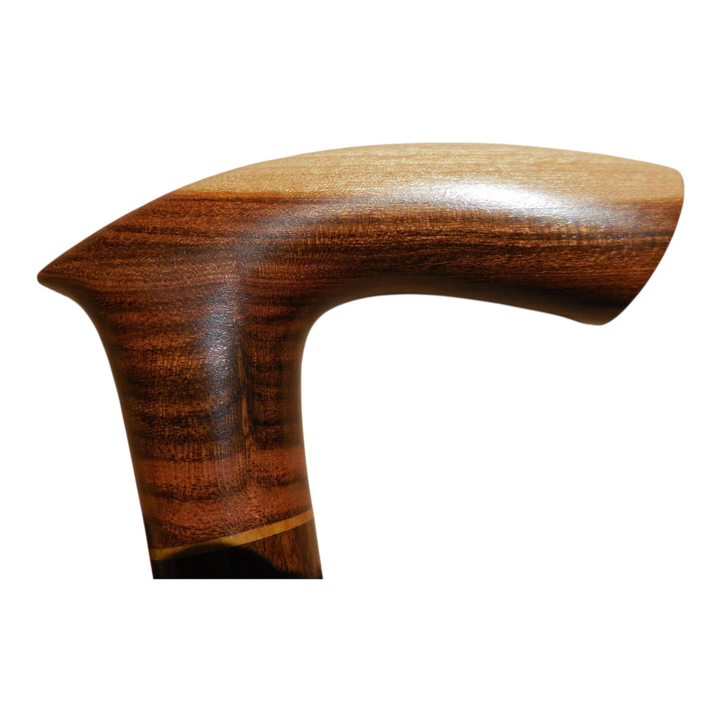 Sombra laurel wood walking cane handle, with pale sapwood along the top and dark heartwood below