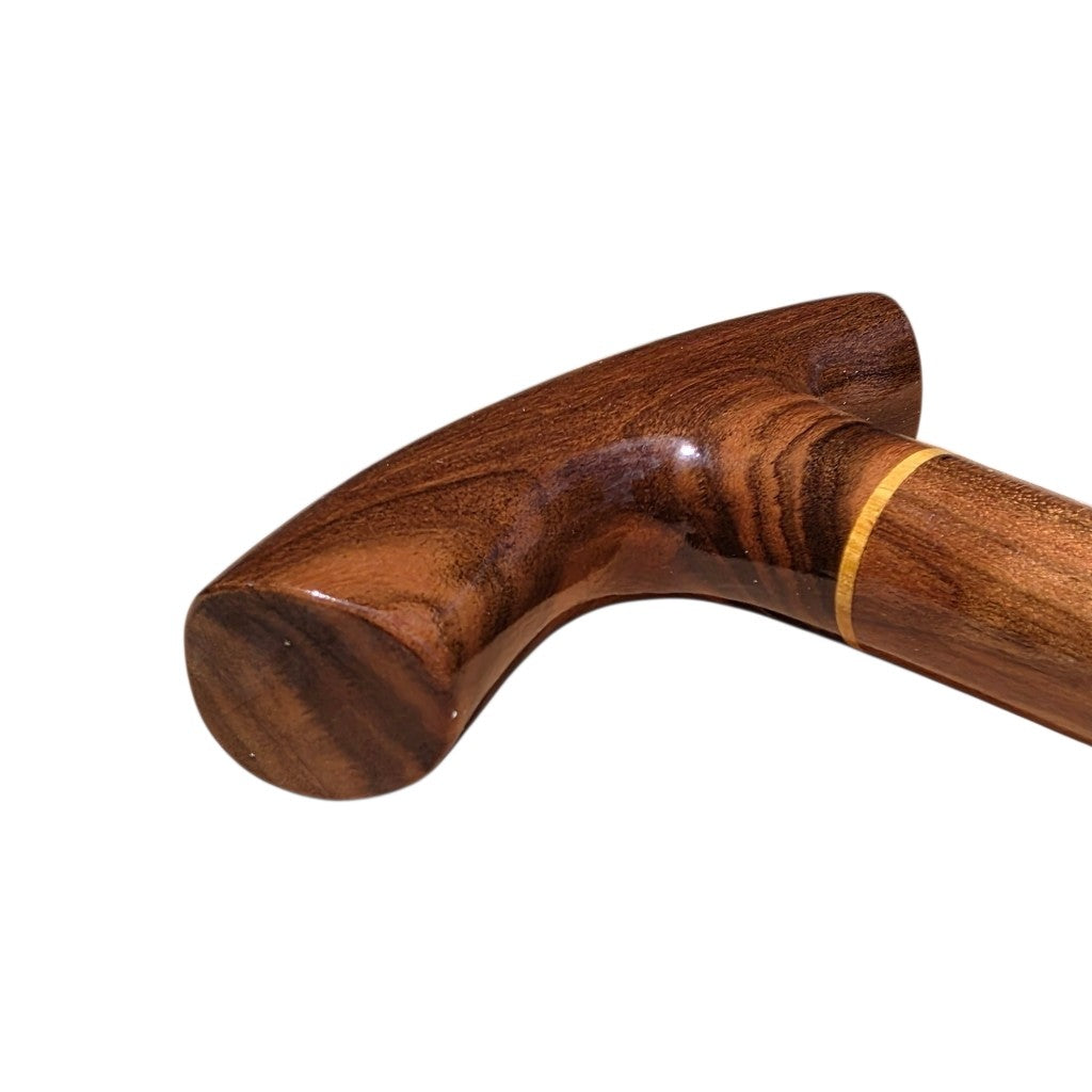 Isthmus cane handle at an angle, showing the paler laurel ring where the handle meets the shaft