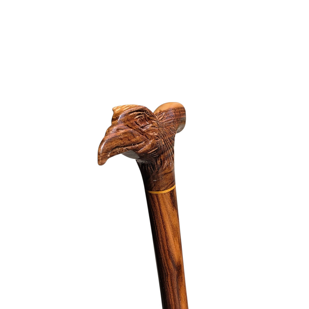 Three-quarter view of the carved eagle handle, showing the beak, brow and feathered neck