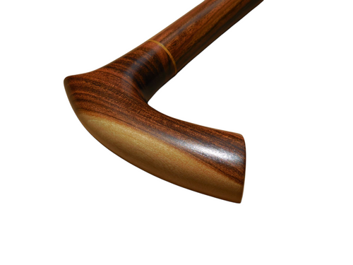 Sombra cane handle at an angle, showing the two-tone laurel grain from blonde to deep brown