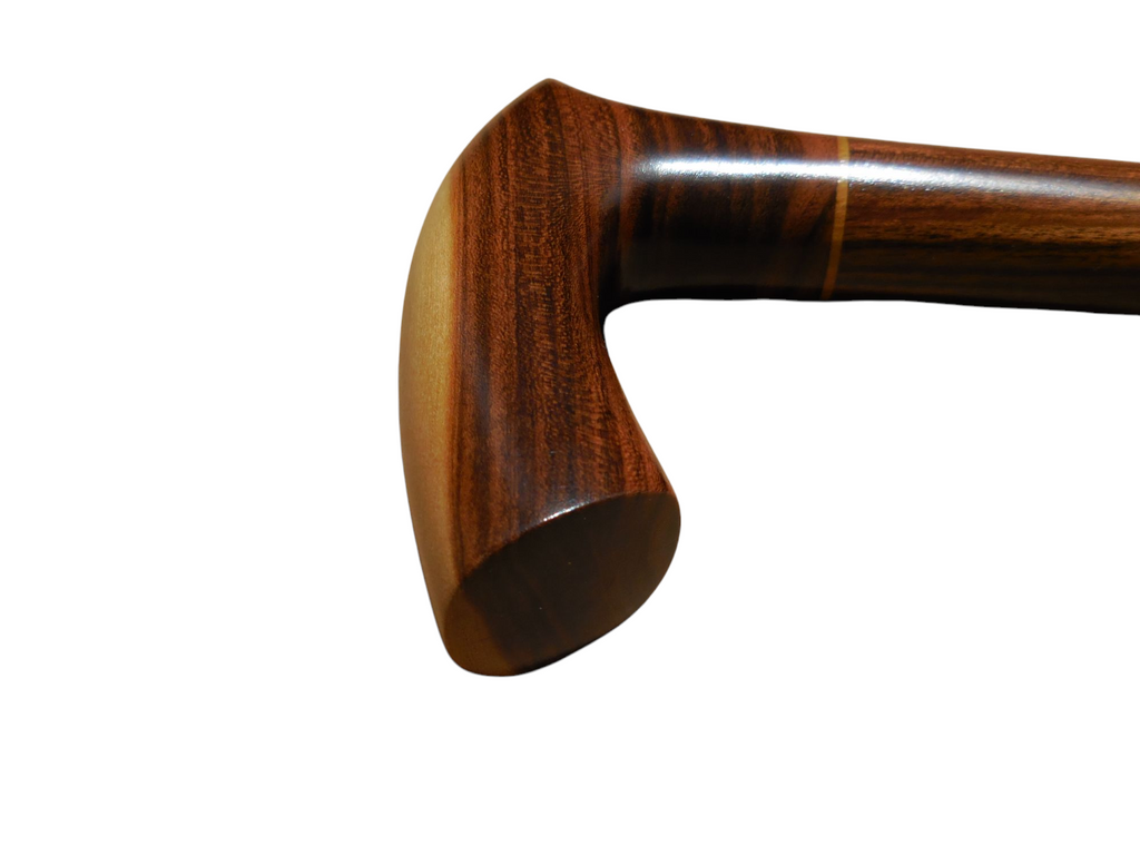 Sombra handle photographed end-on, showing the polished cross-grain of the laurel