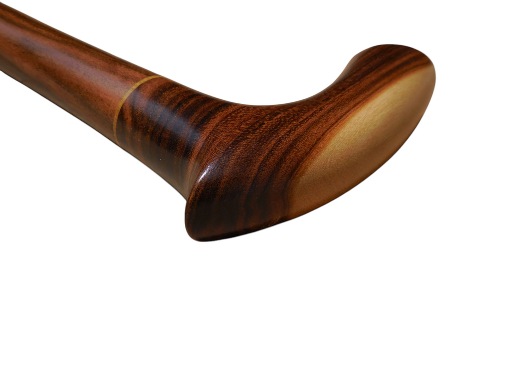 Sombra cane handle with the laurel shaft angling away, showing the grain-matched joint