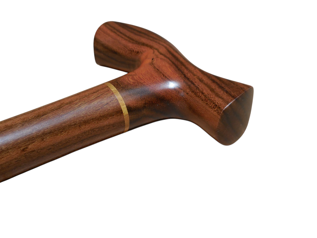 Tikal walking cane handle showing the paler laurel band where the handle meets the shaft