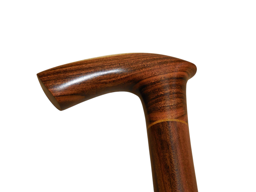 Sombra walking cane handle in profile, showing the forward curve of the grip