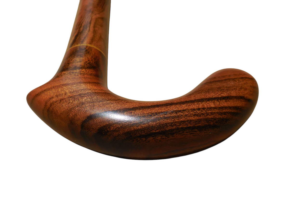 Underside of the Xibalba derby handle, showing the rounded end and polished laurel grain