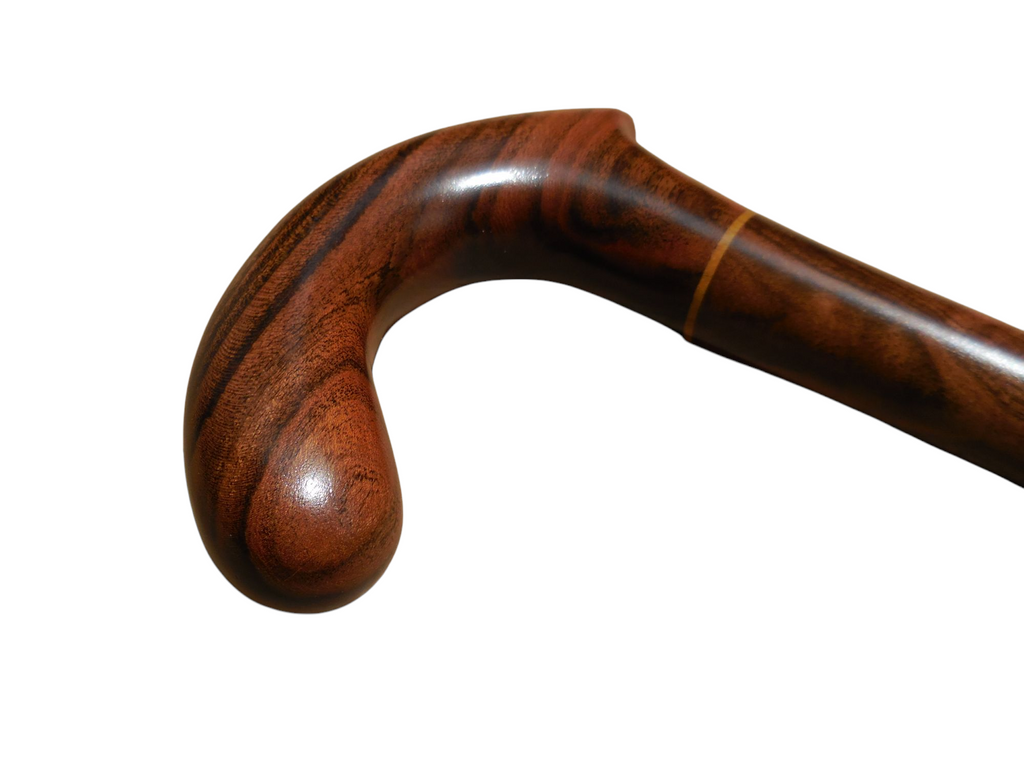 Xibalba derby handle angled downward, showing the curve that fills the palm