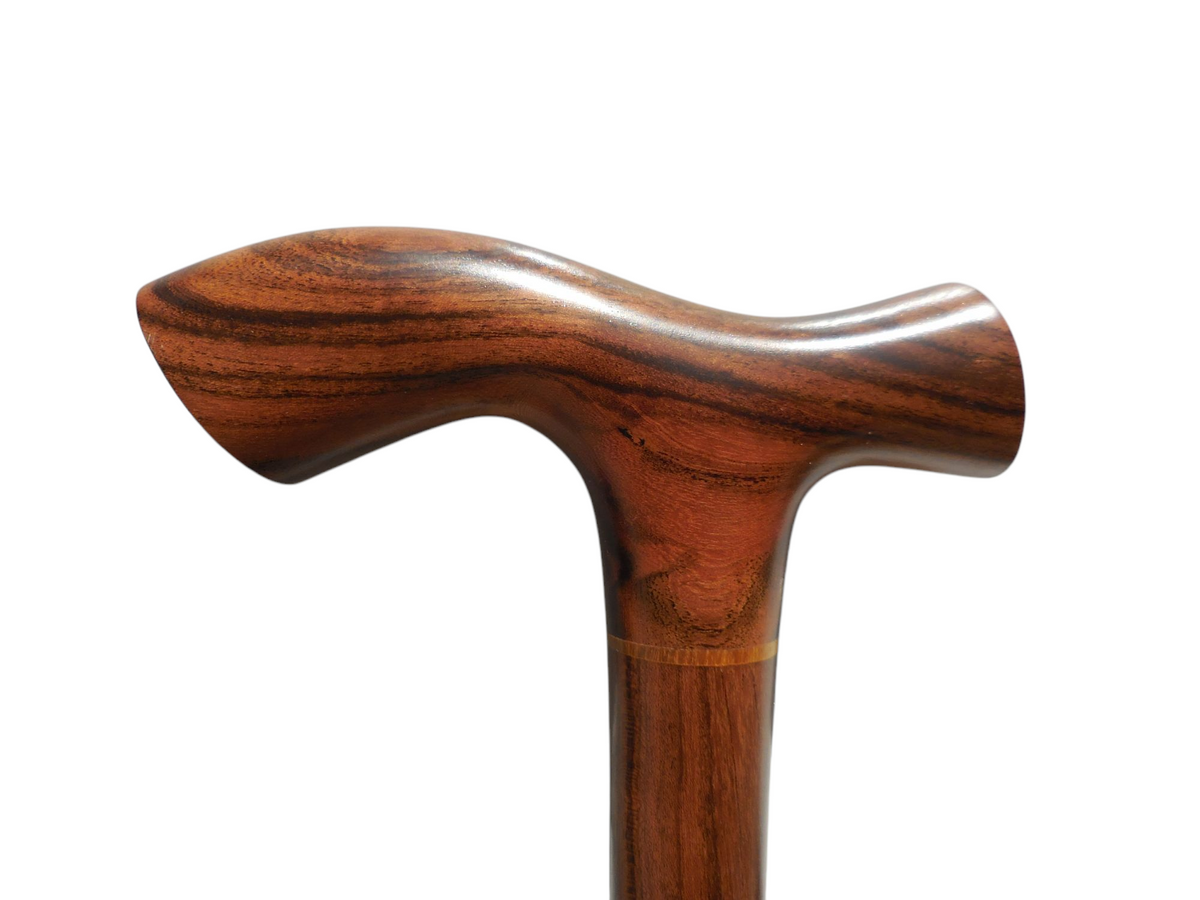Tikal cane handle from the front, showing the palm rest and the grain-matched joint